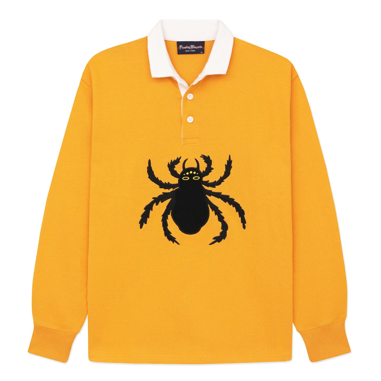 Gold rugby jersey with white collar and embroidered black spider.