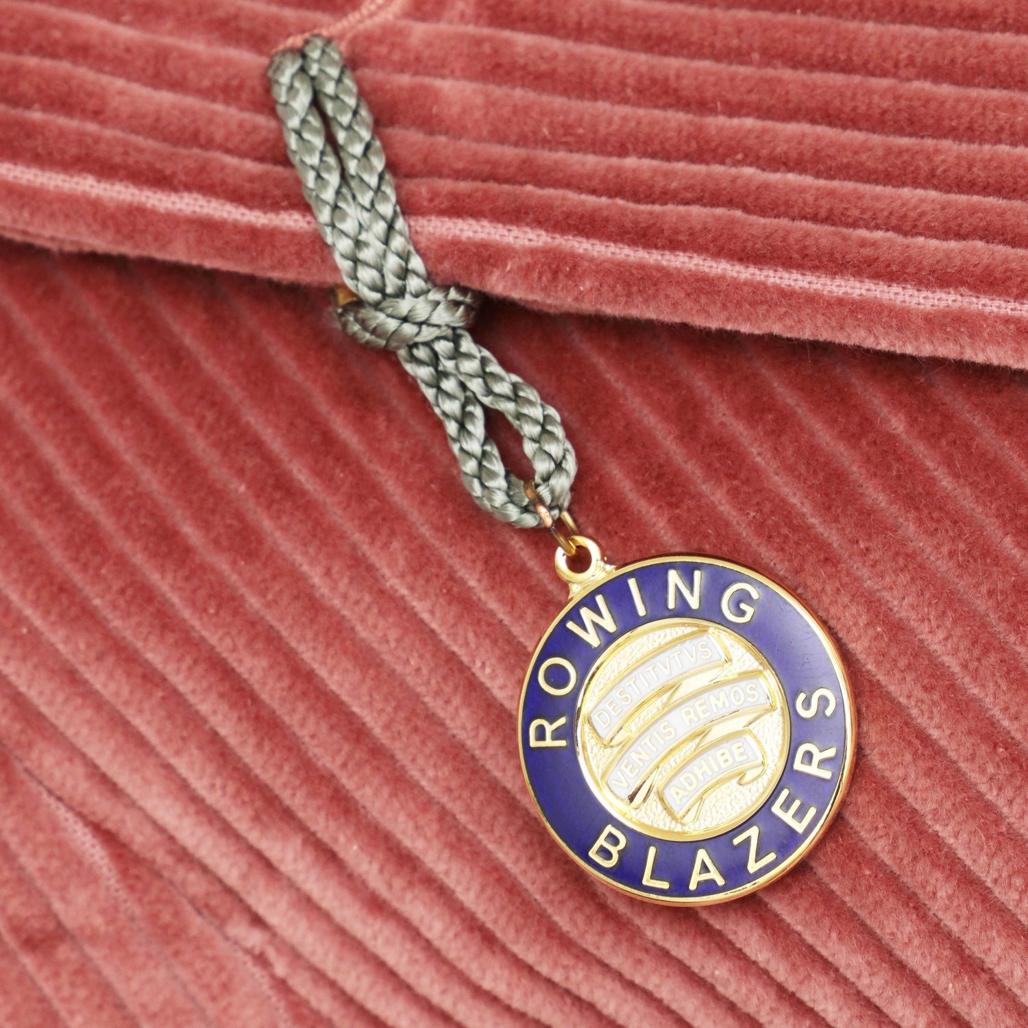 Cloisonné buttonhole badge.