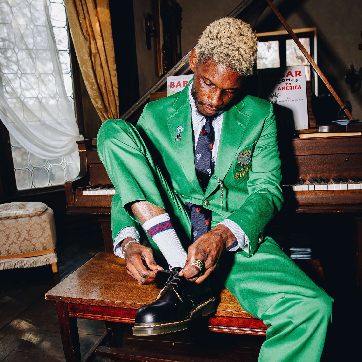 A$AP Nast wearing the hot air balloon pin.