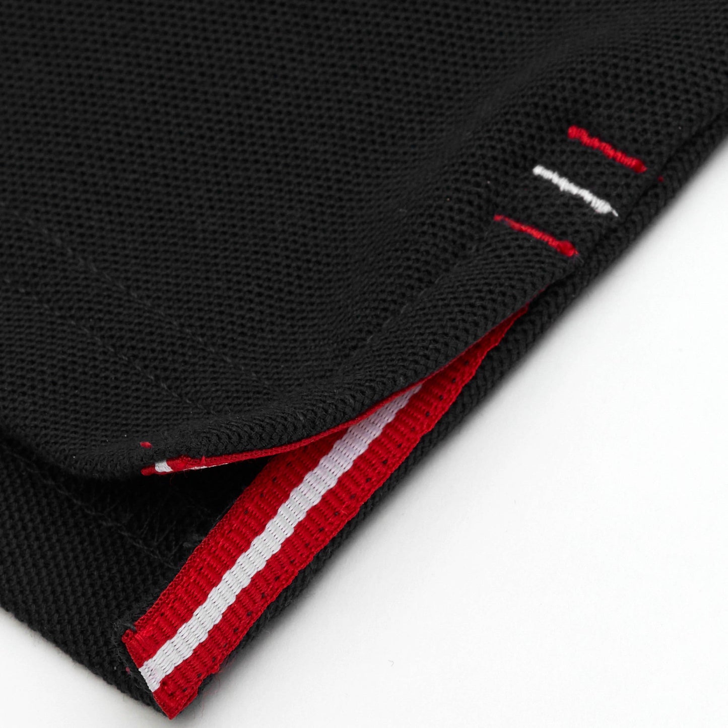 Red and white grosgrain detail on side vent.