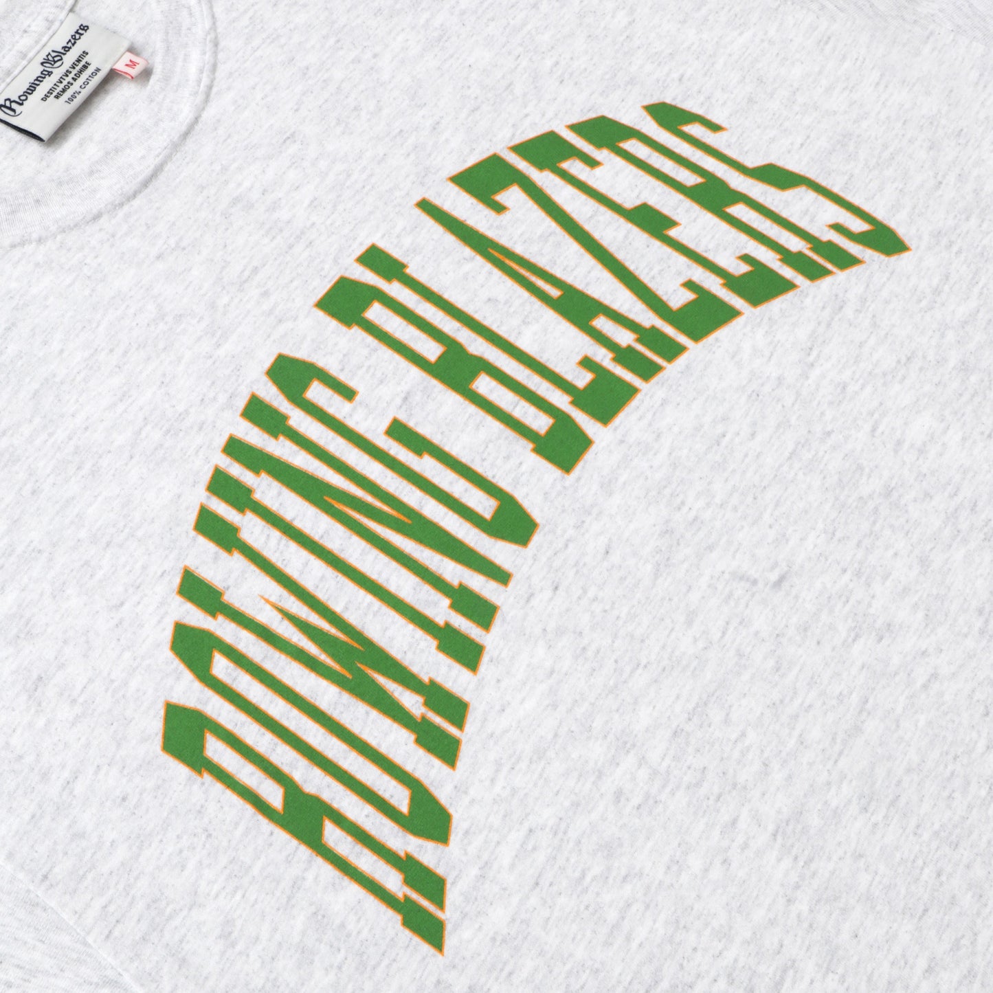 "Rowing Blazers" across the front, collegiate style, in green.