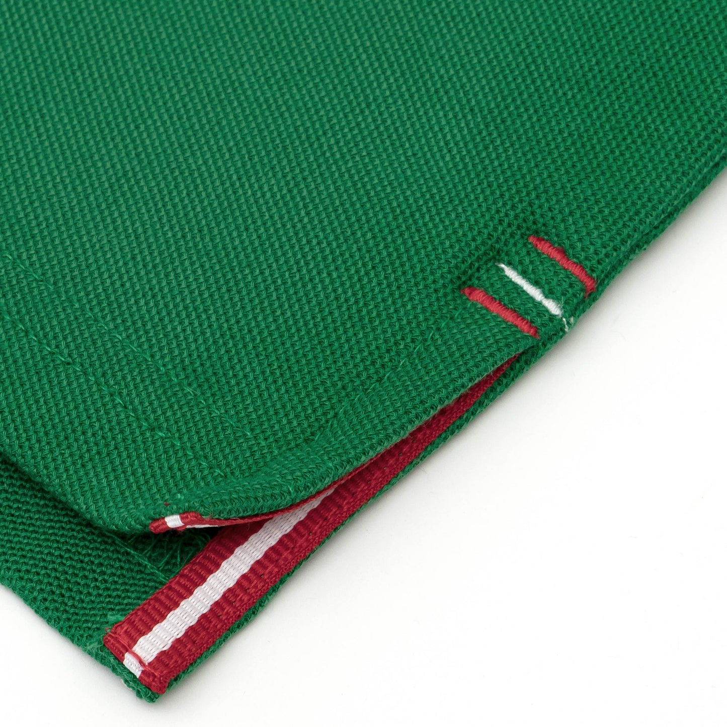 Red and white grosgrain detail on side vent.