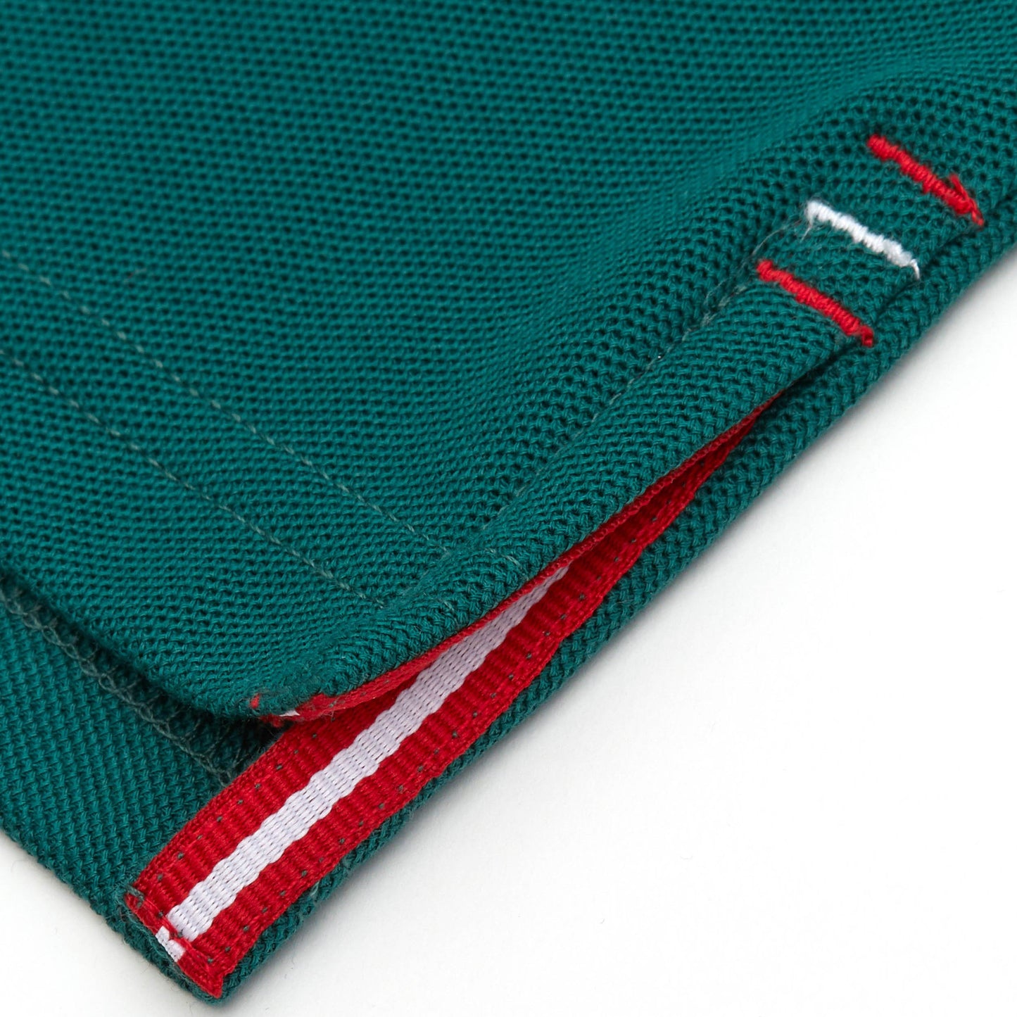 Red and white grosgrain detail on side vent.