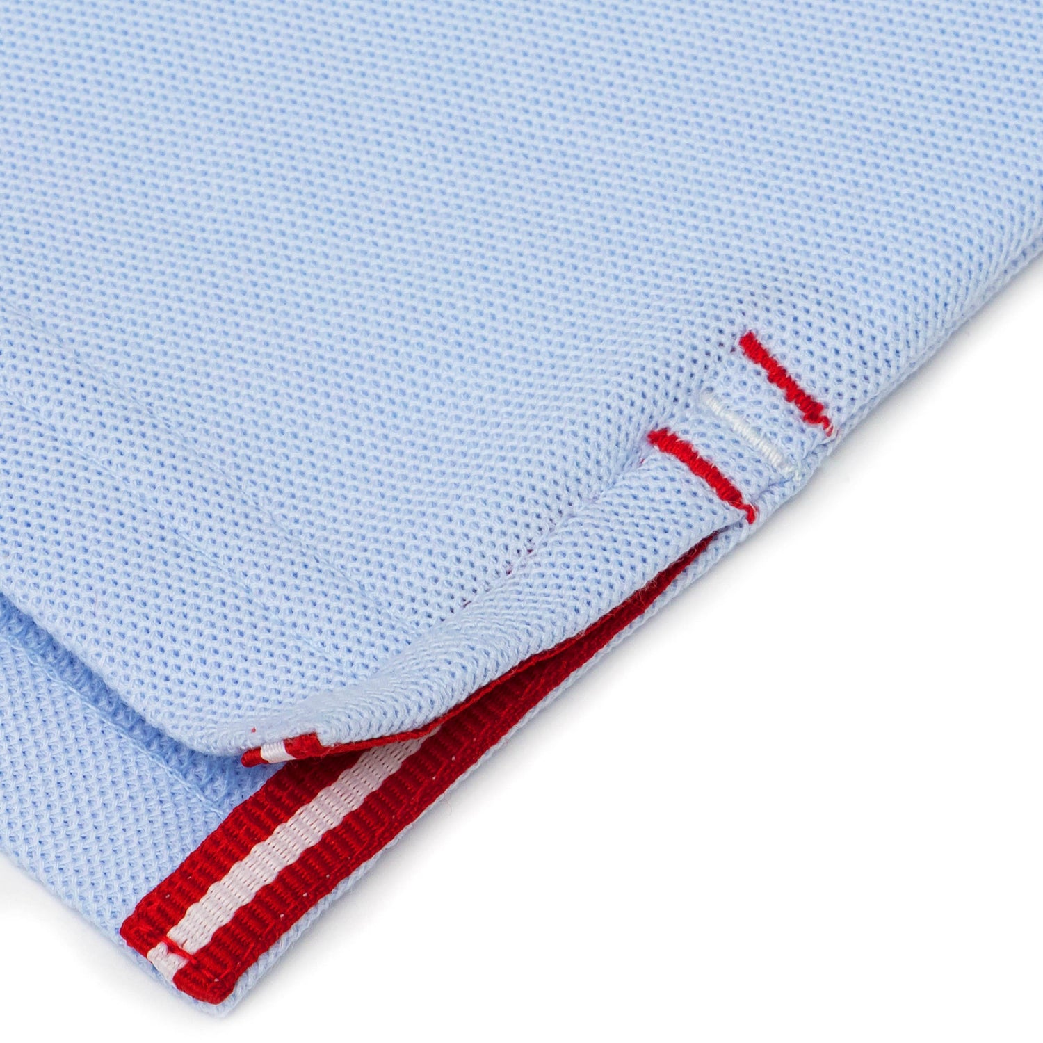 Red and white grosgrain detail on side vent.