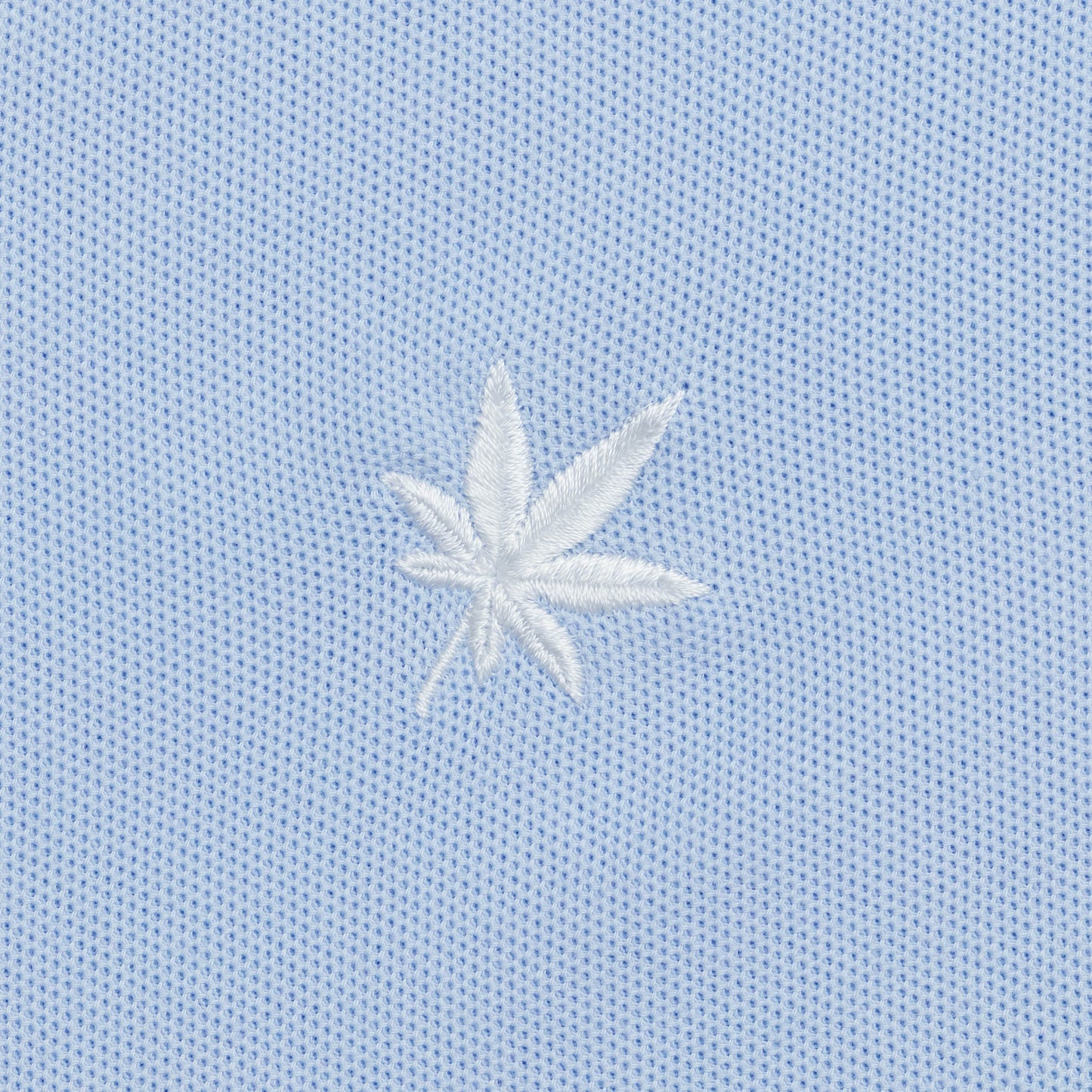 White embroidered leaf.