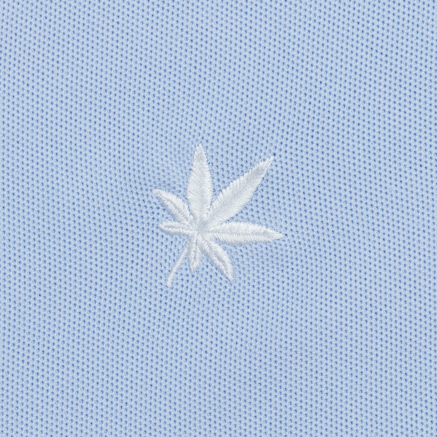 White embroidered leaf.