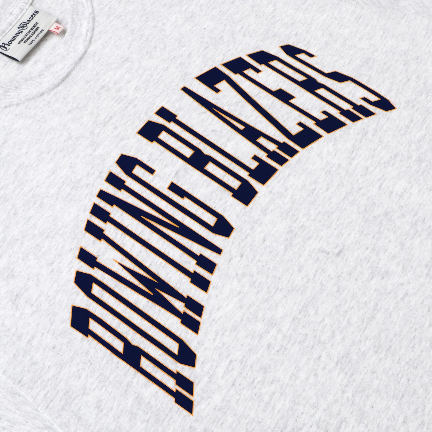 "Rowing Blazers" across the front, collegiate style, in navy.