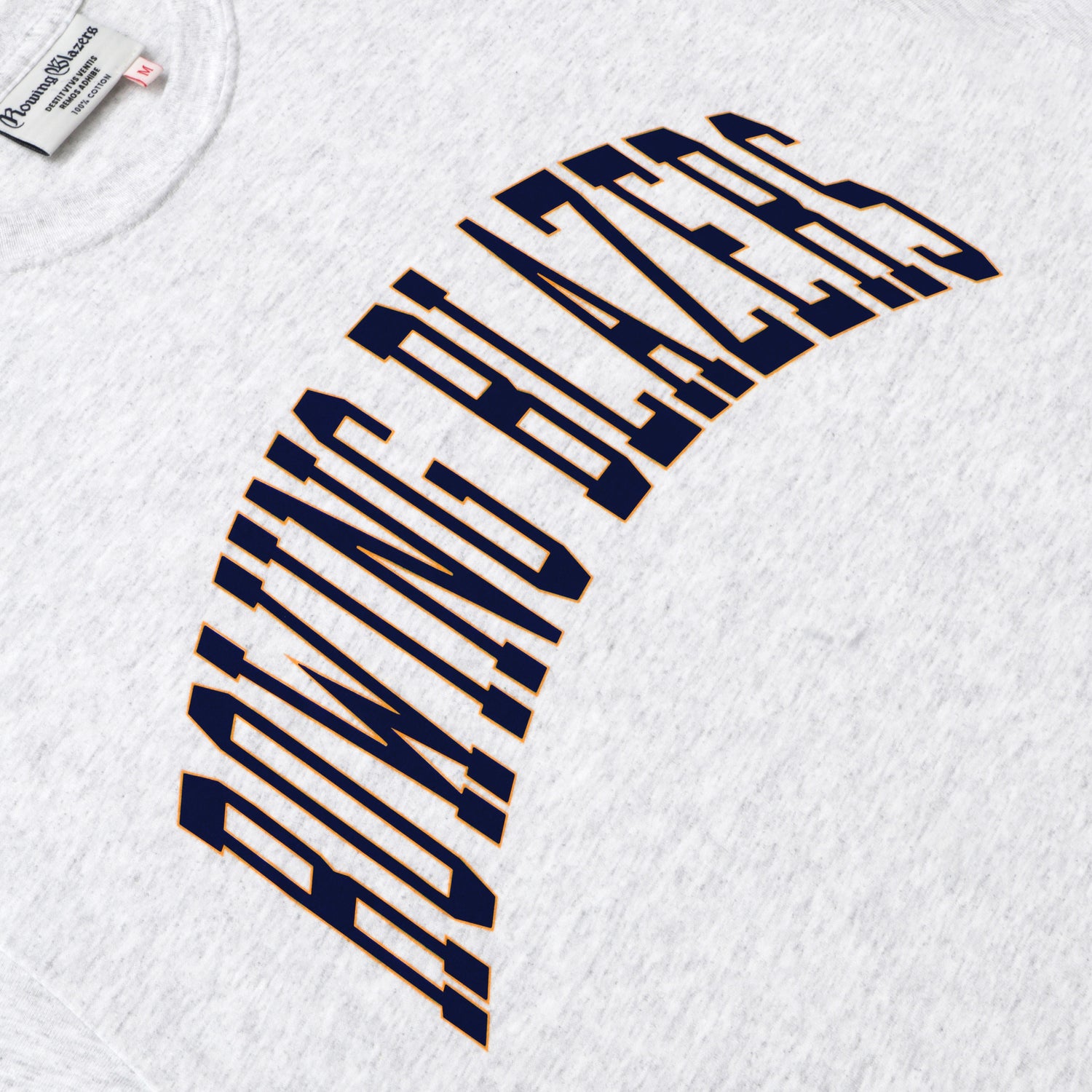 "Rowing Blazers" across the front, collegiate style, in navy.