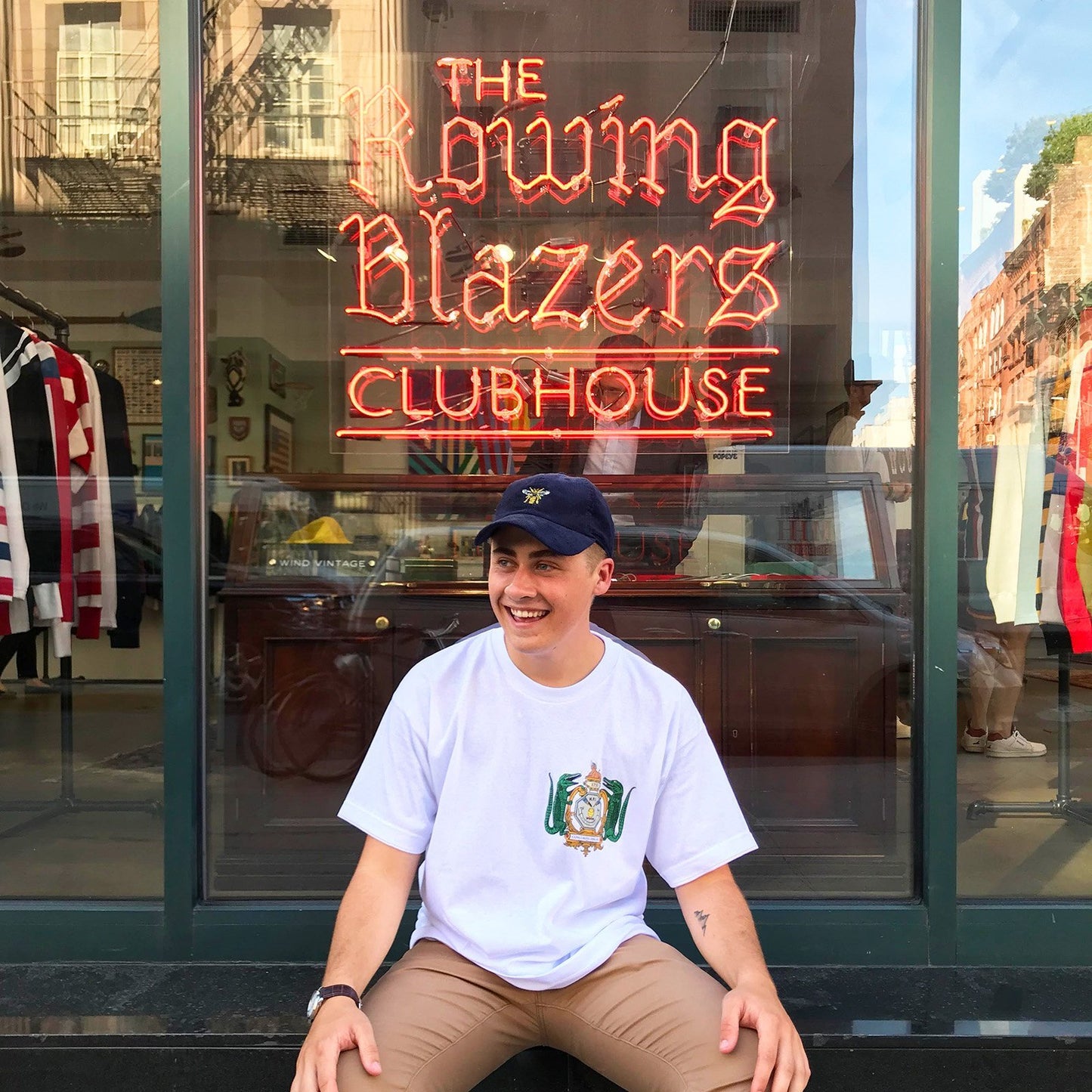 Male model wearing the Navy Drone Cap outside the Rowing Blazers store in downtown New York City.
