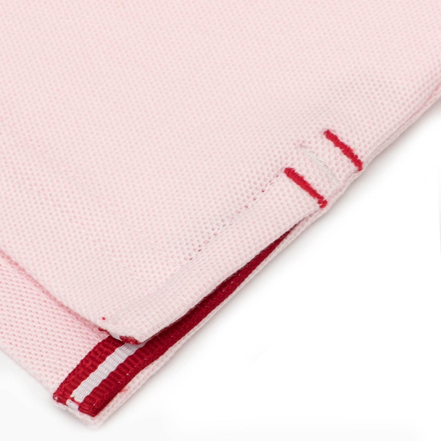 Red and white grosgrain detail on side vent.