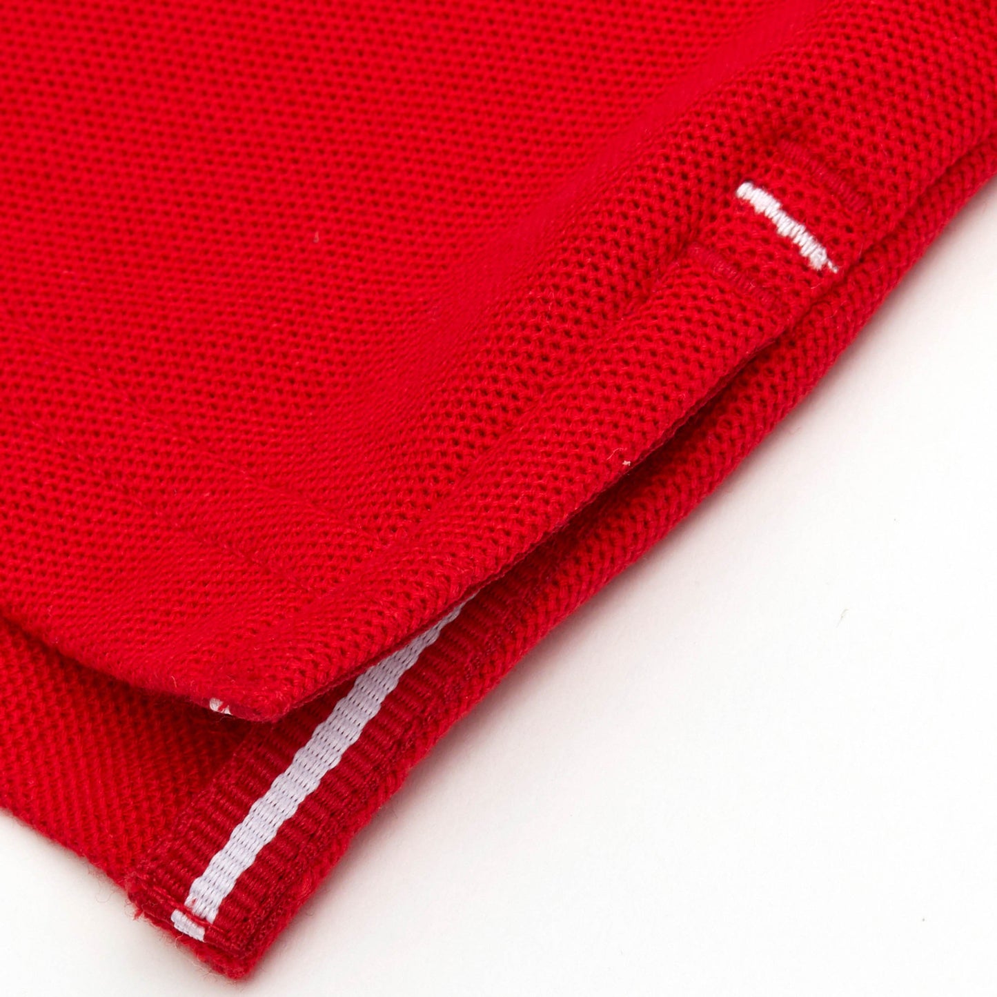 Red and white grosgrain detail on side vent.