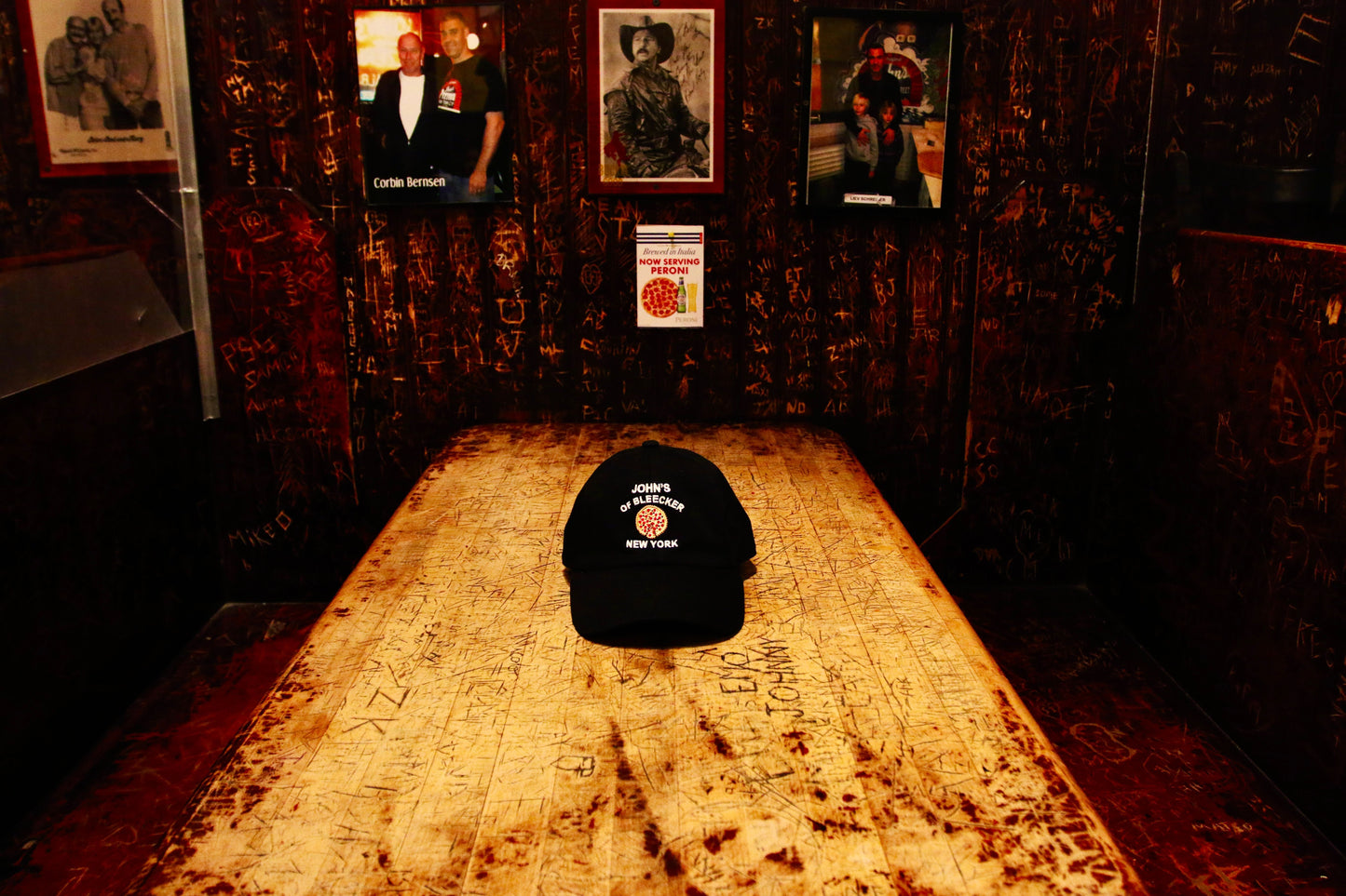 John's Pizza "No Slices" Hat placed on the top of the table at John's Piizza