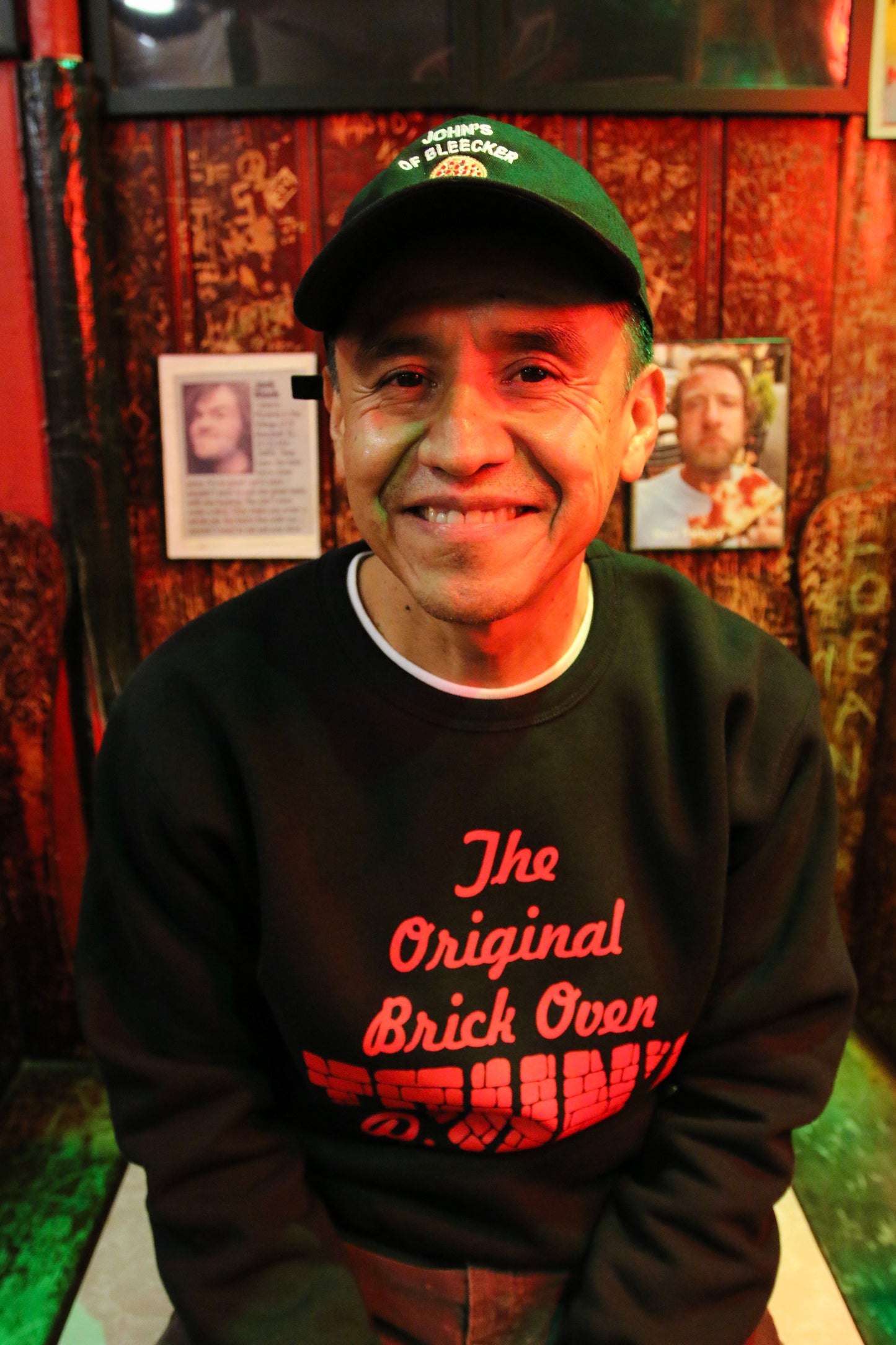 Man wearing the John's Pizza "No Slices" Crewneck