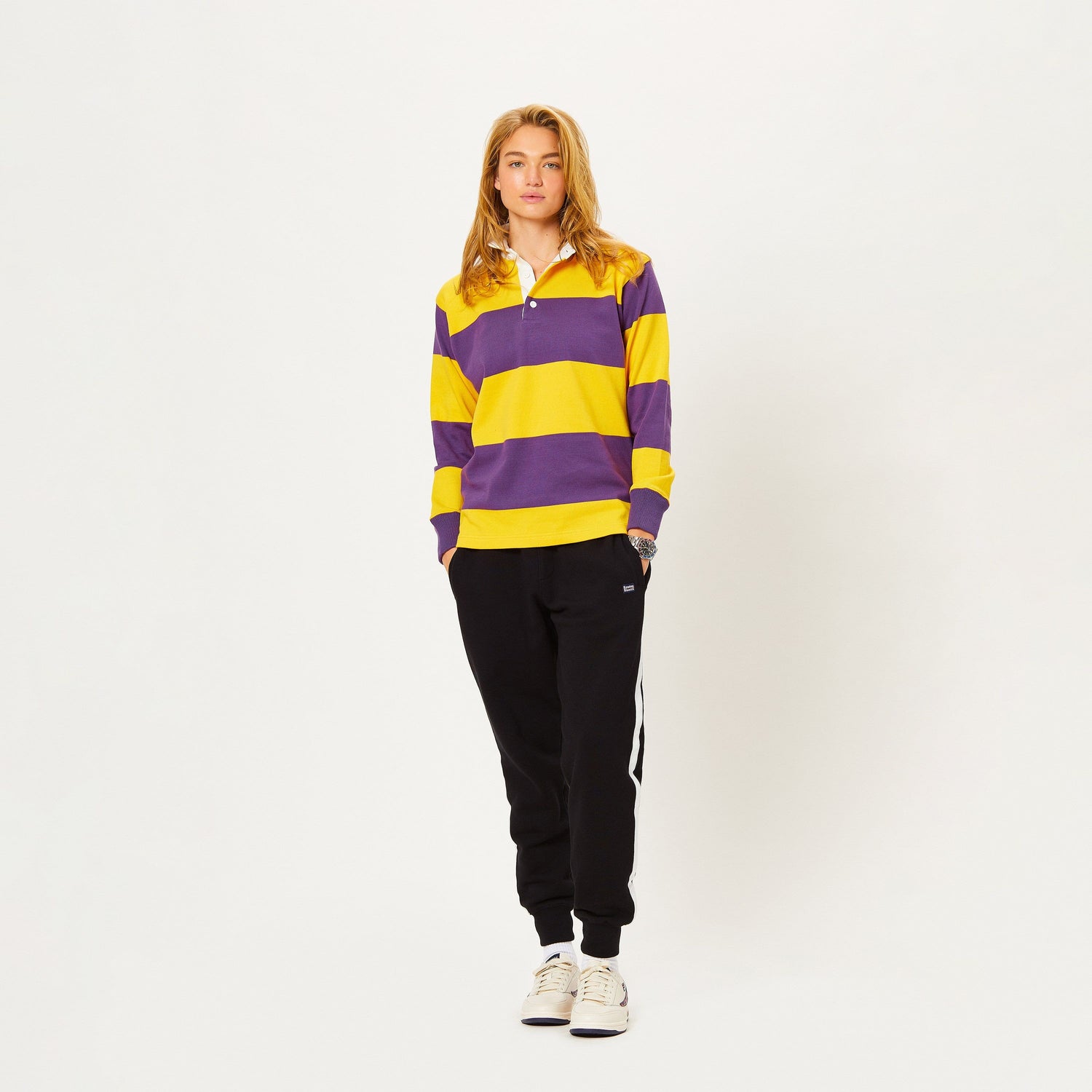 Female model wearing the Horizontal Stripe Gold & Purple Rugby.