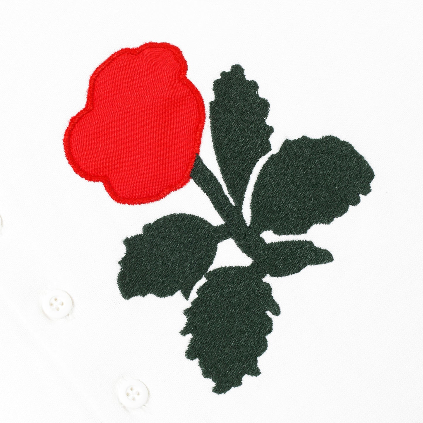 Detail of embroidered rose.