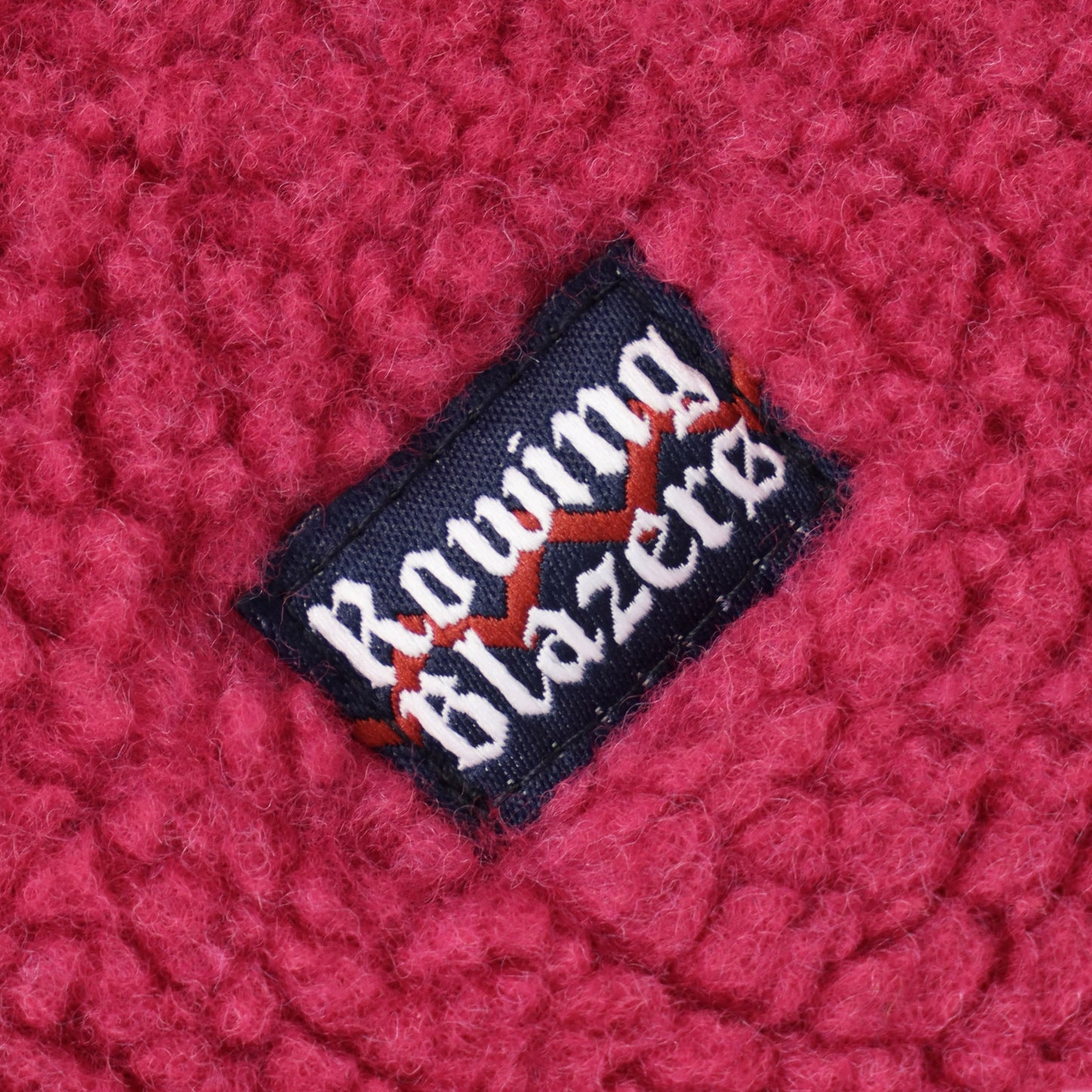Small Rowing Blazers logo tag on left chest.