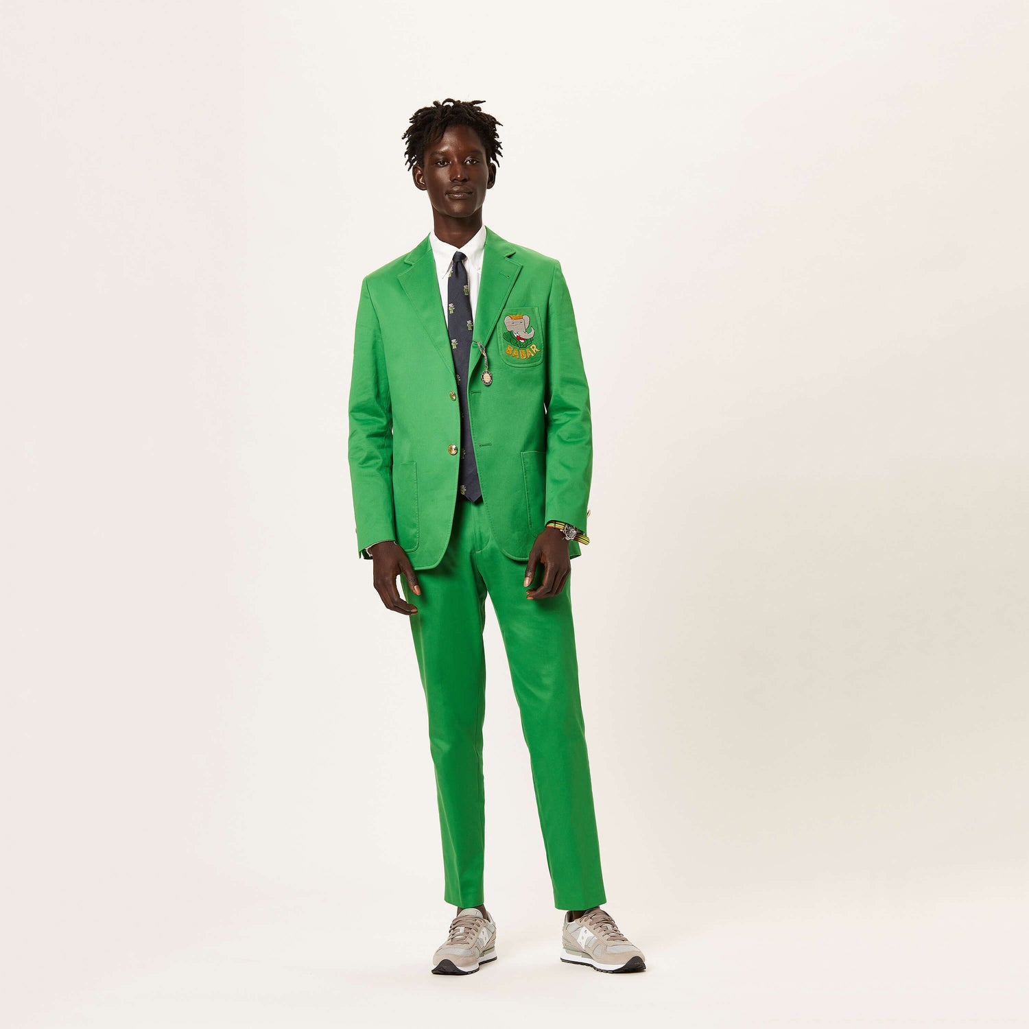 Male model wearing the Babar Suit Tie with a green suit.