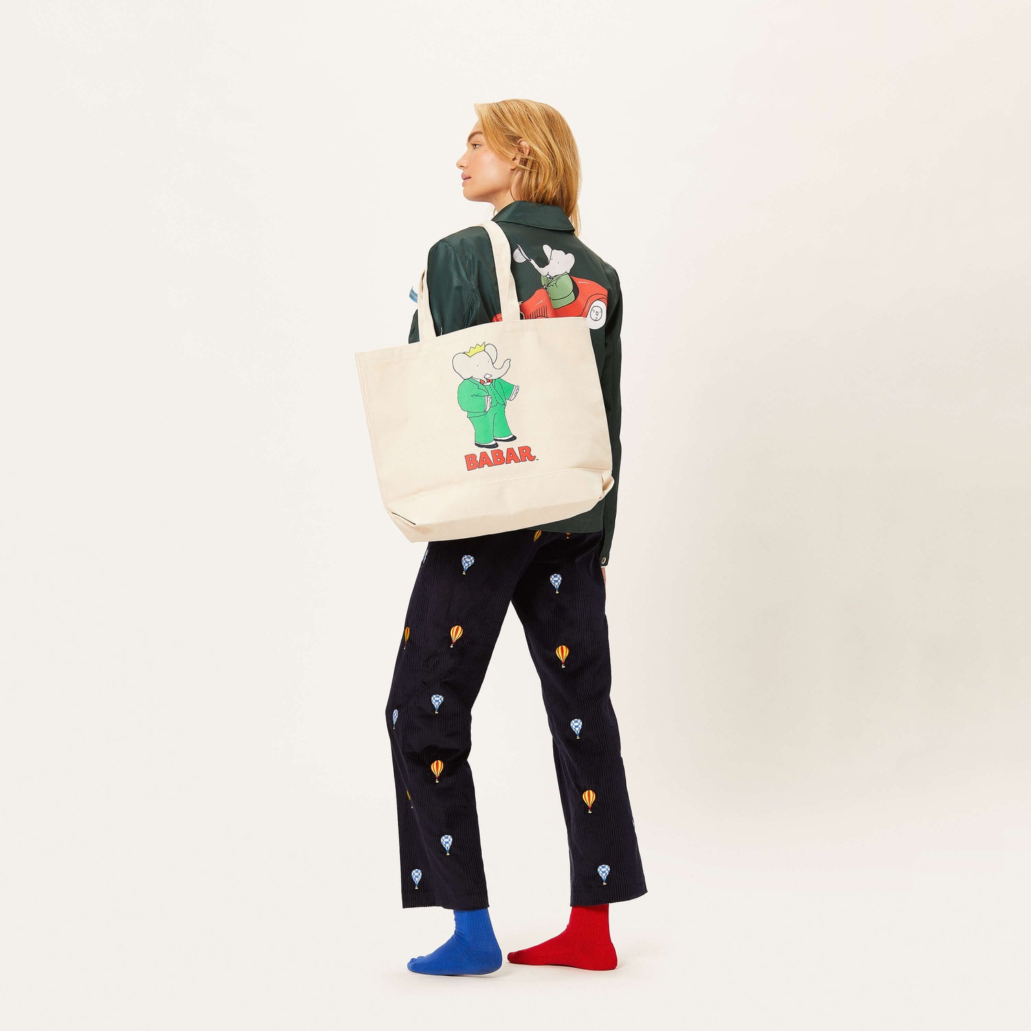 Female model holding the Babar Tote.