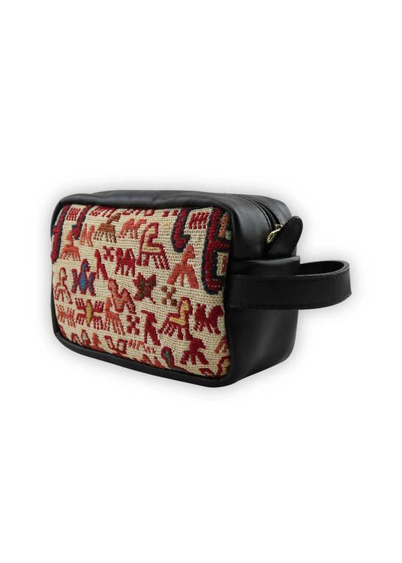 One of a kind dopp kit handmade from Turkish carpets with leather handle.
