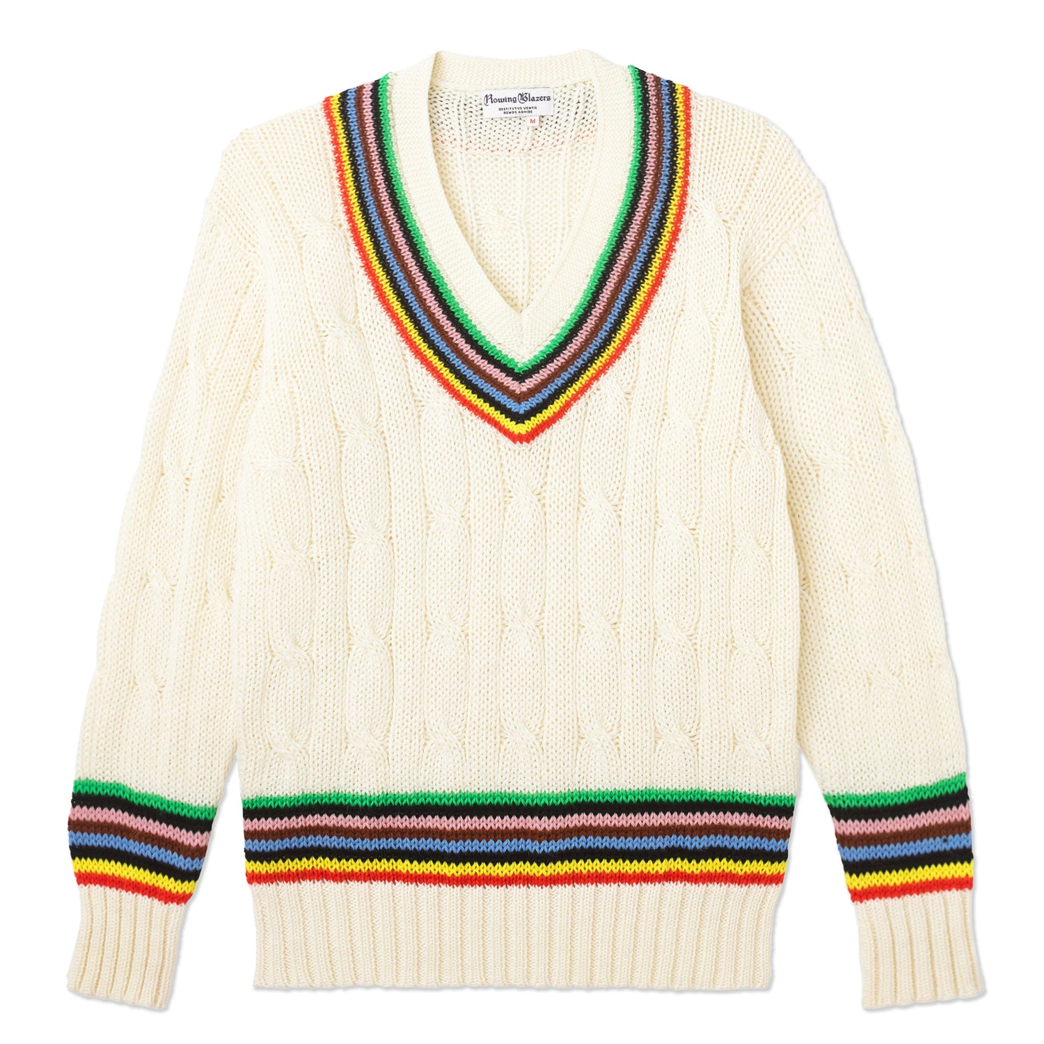 Cable knit cream cricket sweater with our signature croquet stripes around the collar, sleeves, and waist.