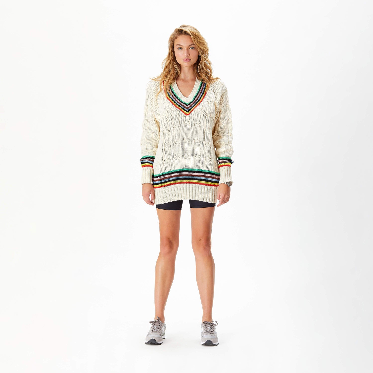 Female model wearing the Cream Wool Cricket Sweater in the Croquet Stripe colorway.