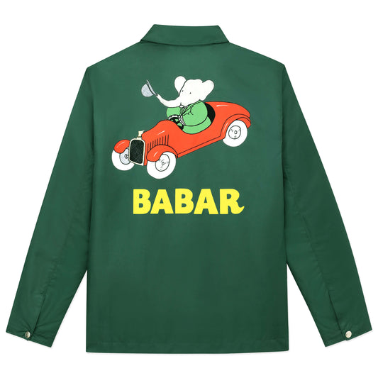 Back of green coach's jacket with printed Babar car motif.