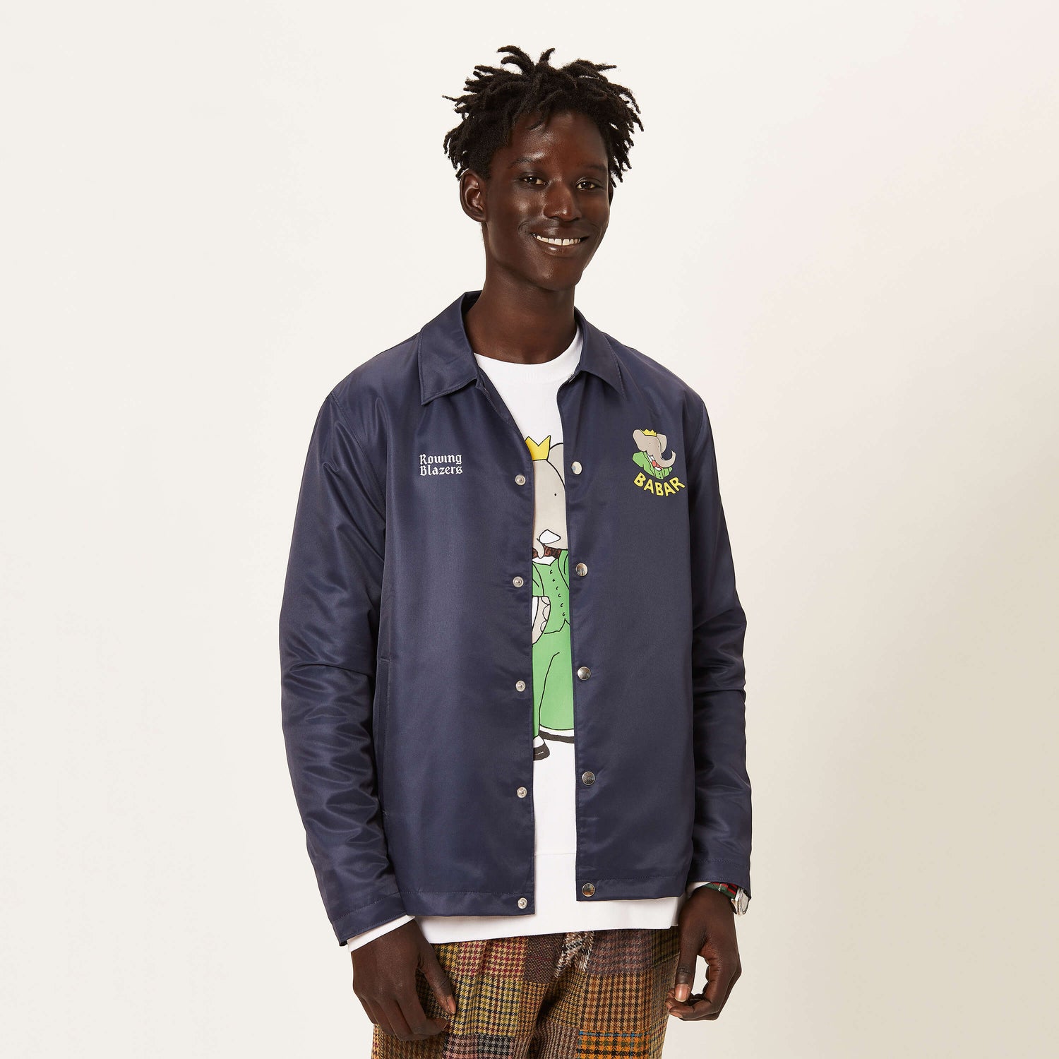 Male model wearing the navy Babar Coach's Jacket.
