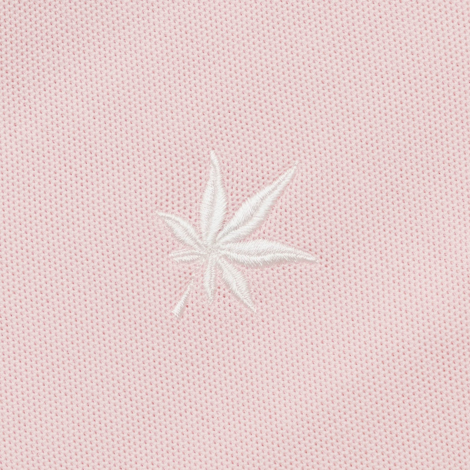 White embroidered leaf.