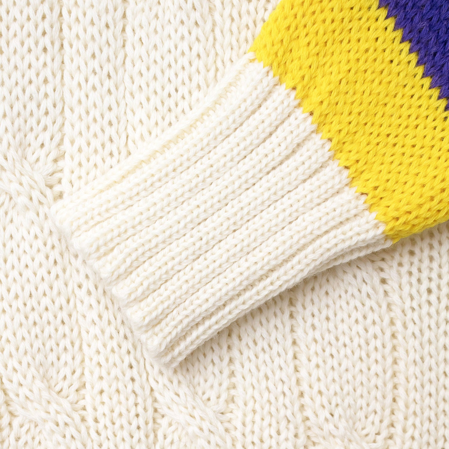 Detail of the cable knit sweater sleeves.