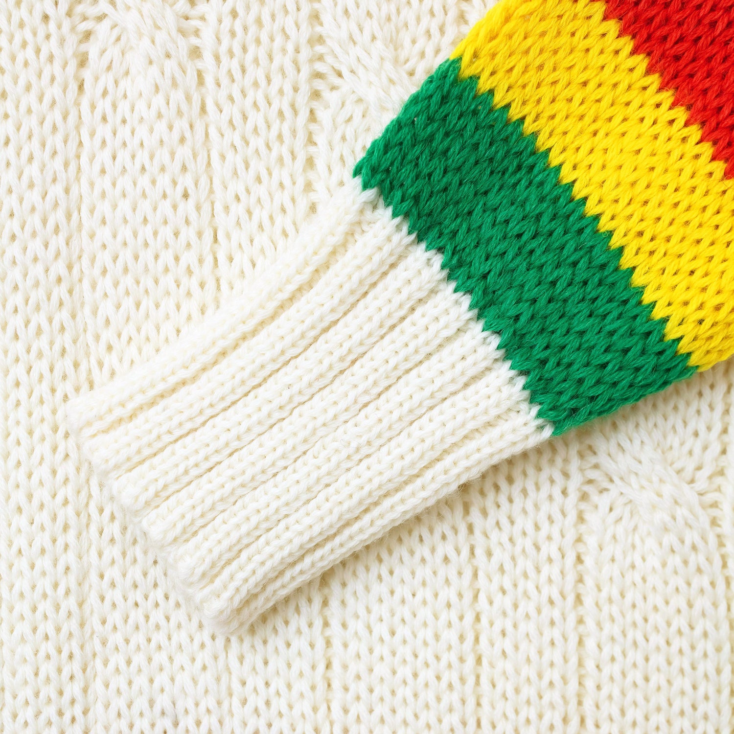 Detail of the cable knit sweater sleeves.