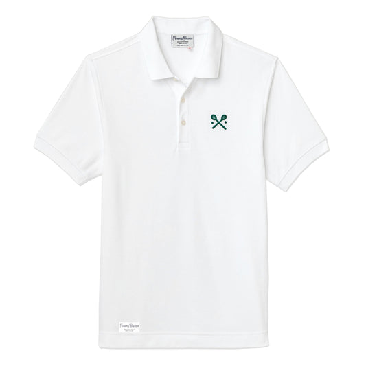White polo jersey with embroidered crossed racquets motif.