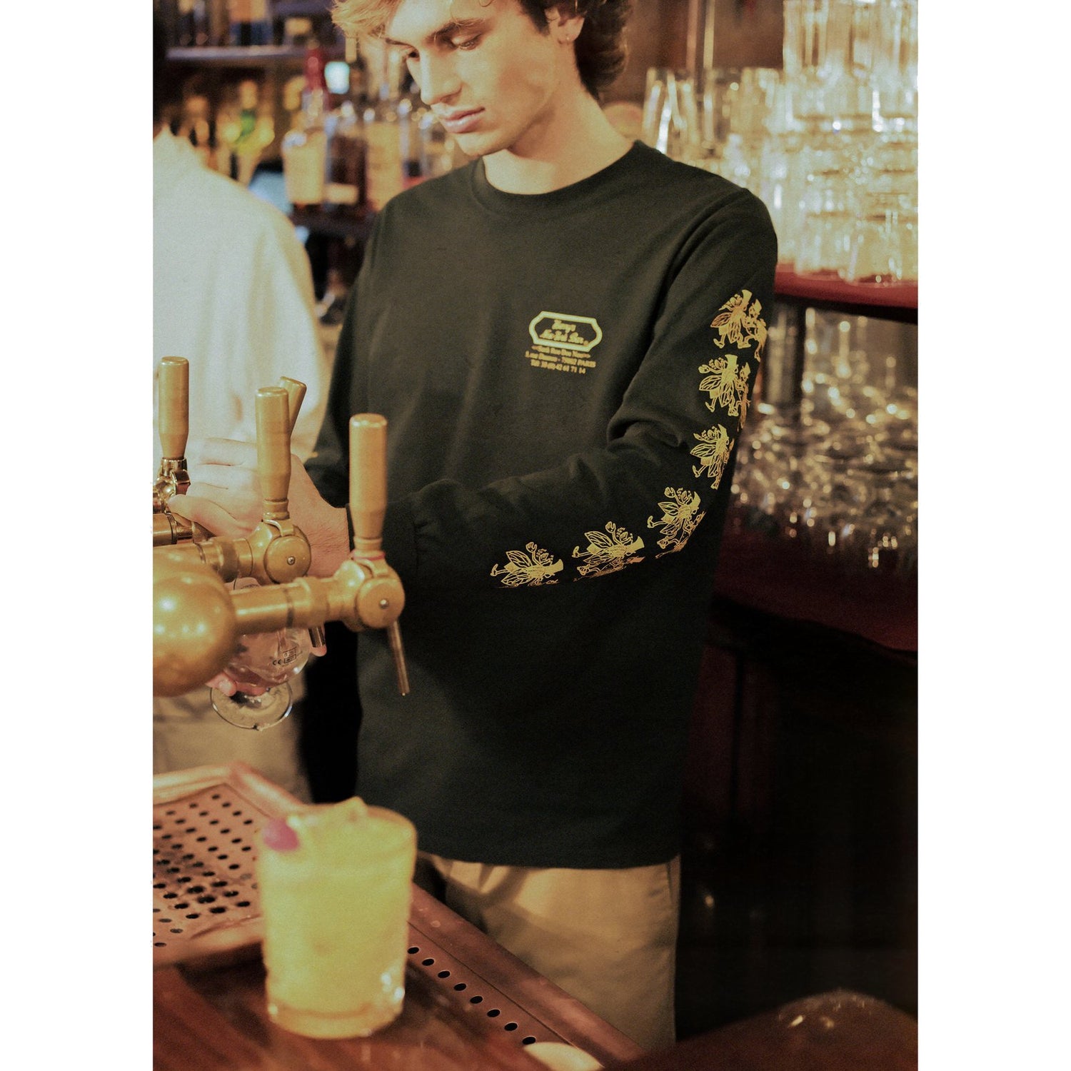 Bartender wearing the Harry's New York Bar Long Sleeve Tee.