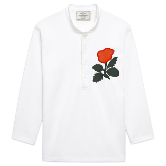 White rugby jersey with embroidered rose.