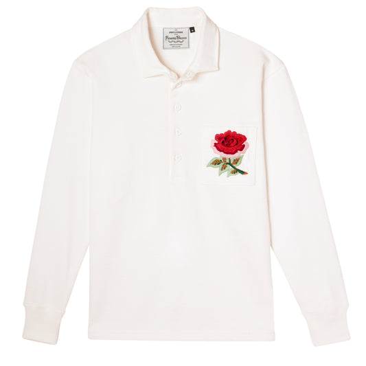 White rugby jersey with an embroidered rose patch.