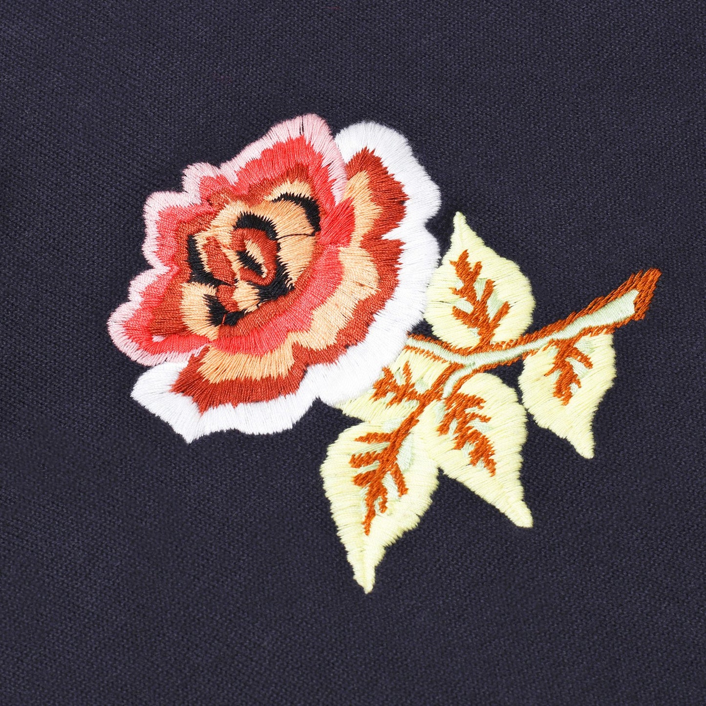 Intricately embroidered rose.