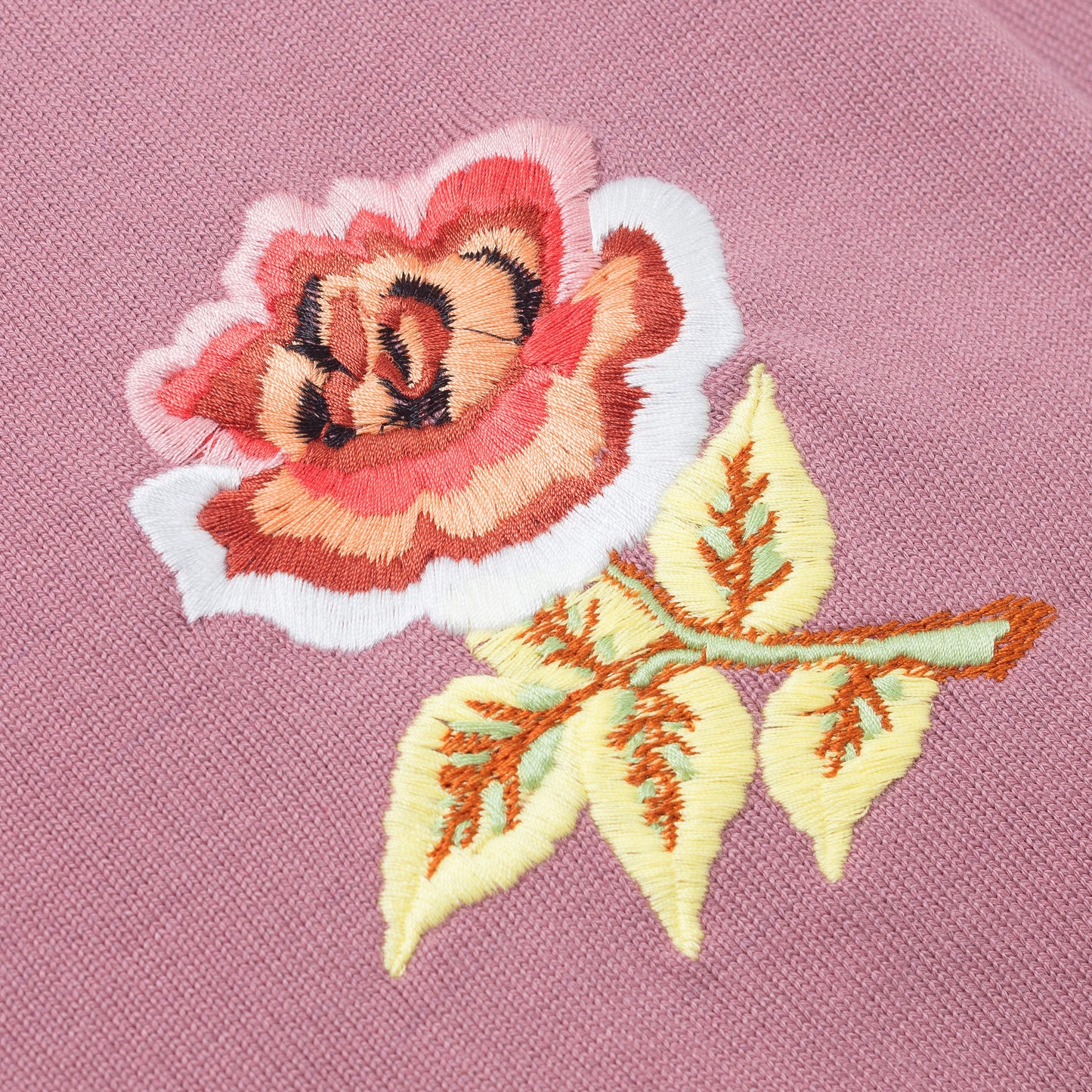 Detail of embroidered rose.