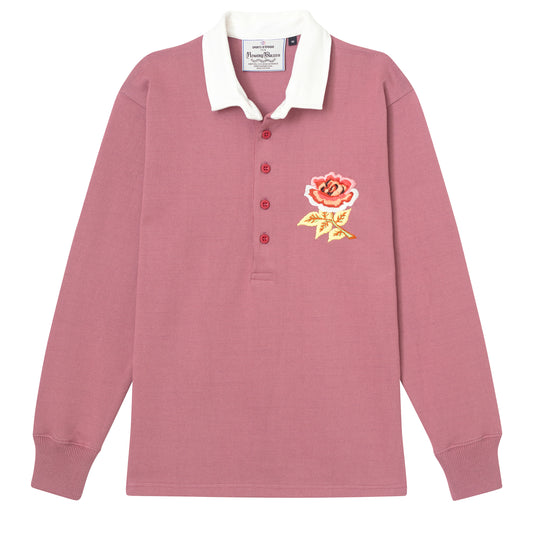 Dusty pink rugby jersey with embroidered rose on the wearer's left chest.